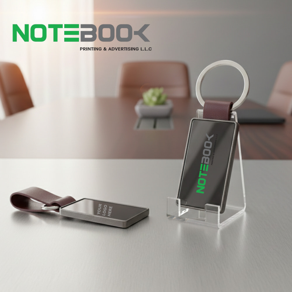 Metal and leather strap keychain with custom logo engraving by Notebook Advertising LLC – premium corporate gift in Dubai