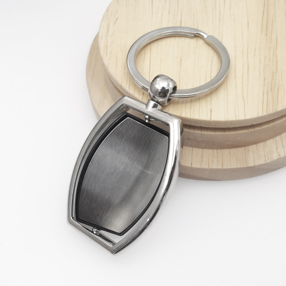 Rotatable metal keychain for custom keychain printing and personalized branding by Notebook Advertising LLC Dubai